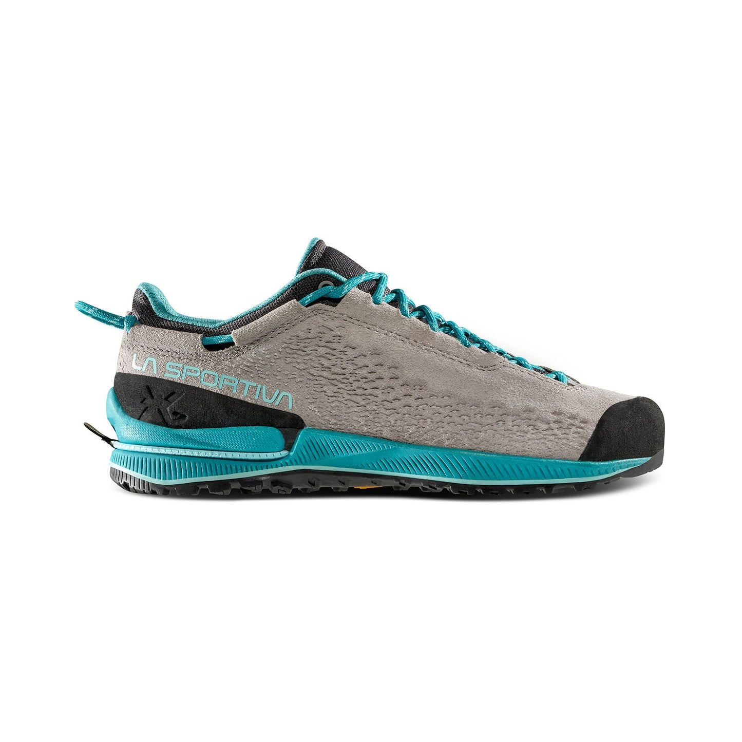 The La Sportiva TX2 EVO Leather Women's is a lightweight, low-cut approach shoe in gray and teal, with Eco Nubuck leather upper, durable toe cap, black sole, and teal accents on the laces, heel, and sole trim.