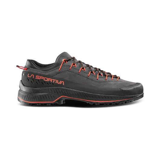 The La Sportiva TX4 EVO is a black technical approach shoe with red accents and laces, featuring rugged Vibram Megagrip tread, shown in side profile against a white background.