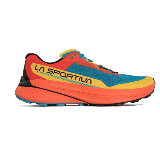 The La Sportiva Prodigio is a colorful trail running shoe with a blue mesh upper, red and yellow overlays, black accents, an orange and blue XFlow foam sole, and “LA SPORTIVA” branding on the side.