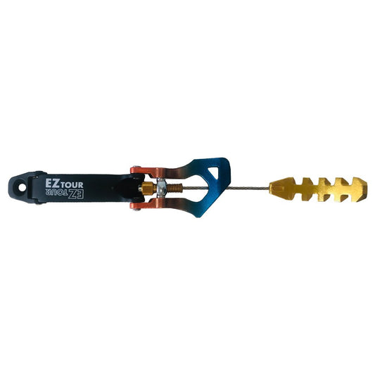 A close-up of the La Sportiva Cuff Buckle Synchro/Shadow N.4 (Pair) shows a black EZ TOUR arm, blue and orange metal connector, coiled spring, and gold notched piece—perfect replacement buckles for your La Sportiva ski boots.