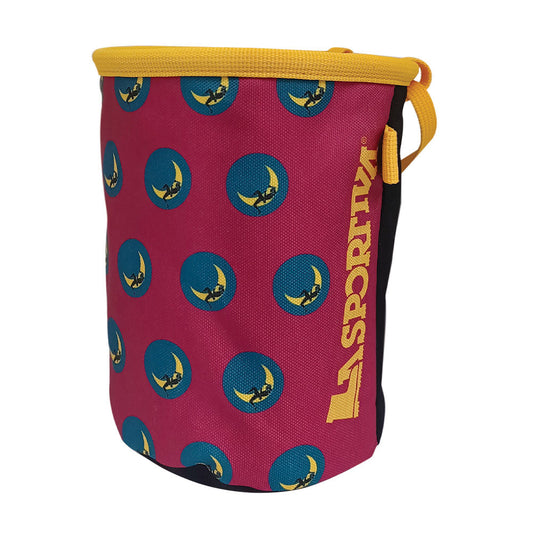 The La Sportiva Climbing On The Moon Chalk Bag is a cylindrical pink chalk bag with blue circles, yellow logo patterns, yellow trim and carrying loop. The vertical La Sportiva name embodies the Climbing on the Moon spirit.