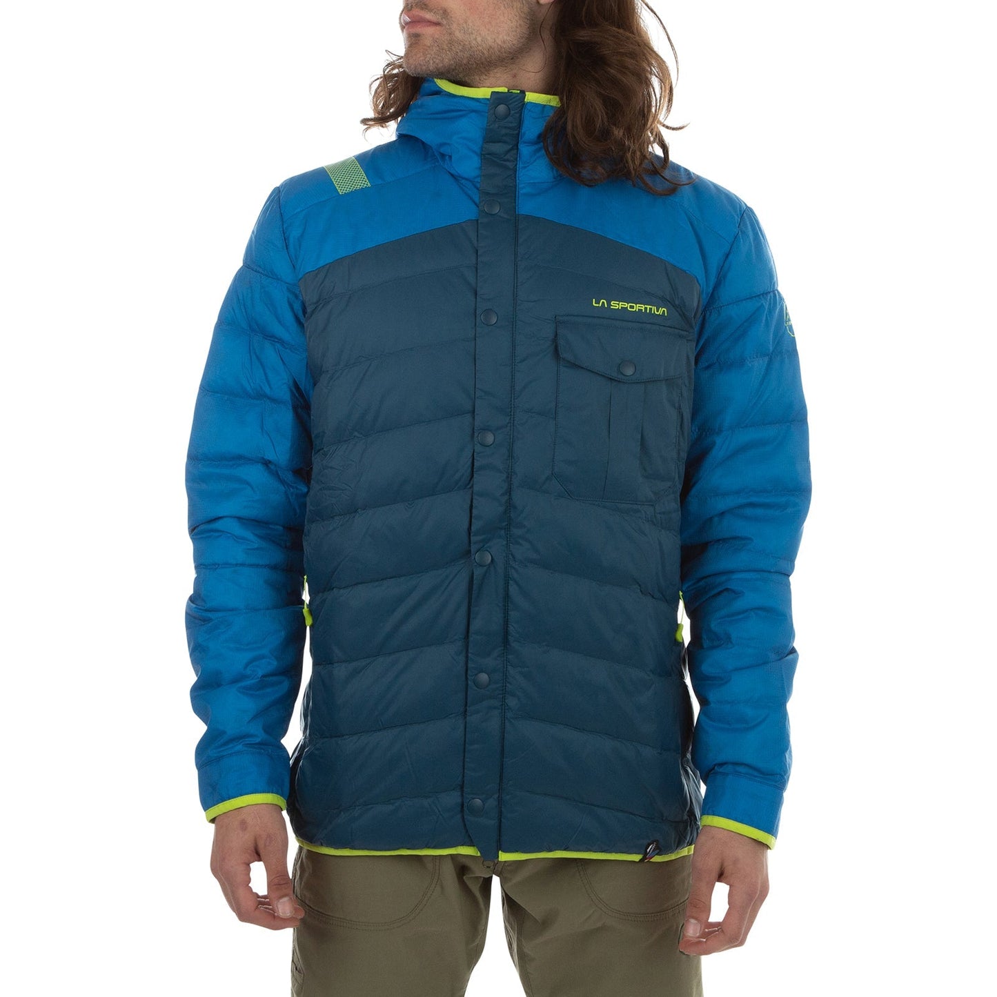 A person wearing the La Sportiva Wild Down Jacket Men's—blue and turquoise with a chest pocket and lime green accents—stands with arms relaxed at their sides. This jacket provides excellent thermal protection.