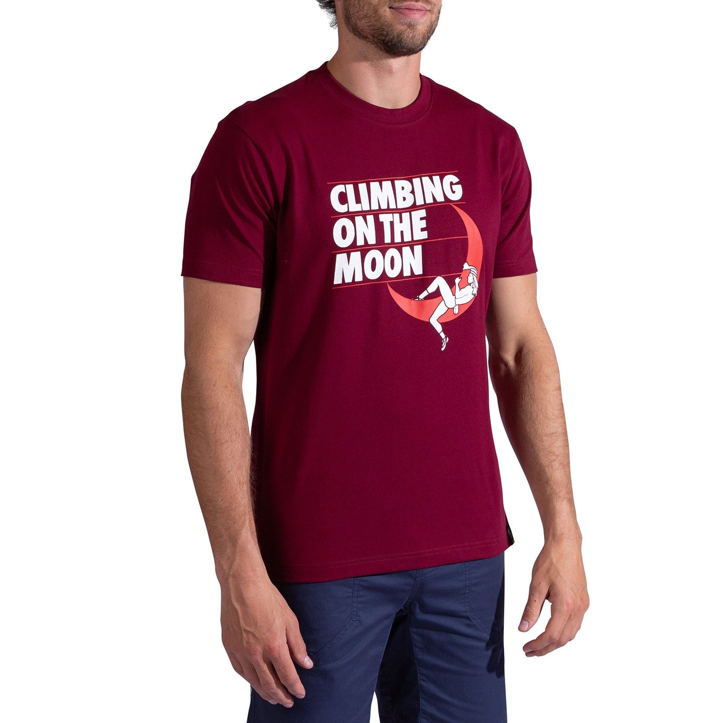 A man wears the La Sportiva Moon Rock T-Shirt Men's in maroon, made from organic cotton, with "CLIMBING ON THE MOON" text and a climber illustration hanging from the letter G.