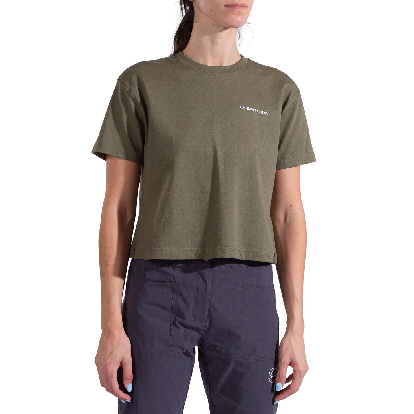 A woman in a La Sportiva Redgarden Crop T-Shirt for women, olive green with logo on the chest, paired with dark navy pants. Her face is partially out of frame.
