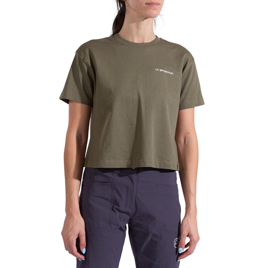A woman in a La Sportiva Redgarden Crop T-Shirt for women, olive green with logo on the chest, paired with dark navy pants. Her face is partially out of frame.