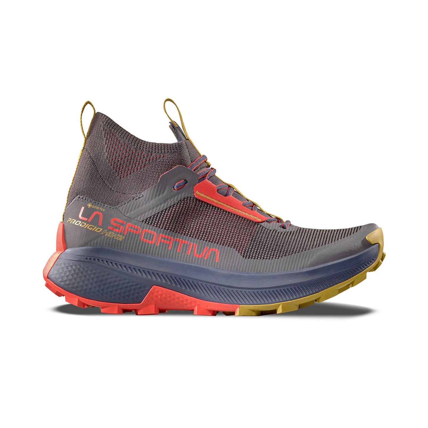 The La Sportiva Prodigio Hike GTX is a grey and orange mid-top hiking shoe with yellow accents, a textured sole, and side branding—perfect for those seeking high performance beyond standard boots. Displayed on a white background.