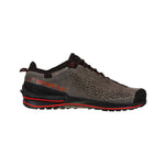 The La Sportiva TX2 EVO Leather is a gray and black lightweight approach shoe with red accents, featuring a textured suede upper, black laces, and a rugged resoleable outsole made for outdoor activities.