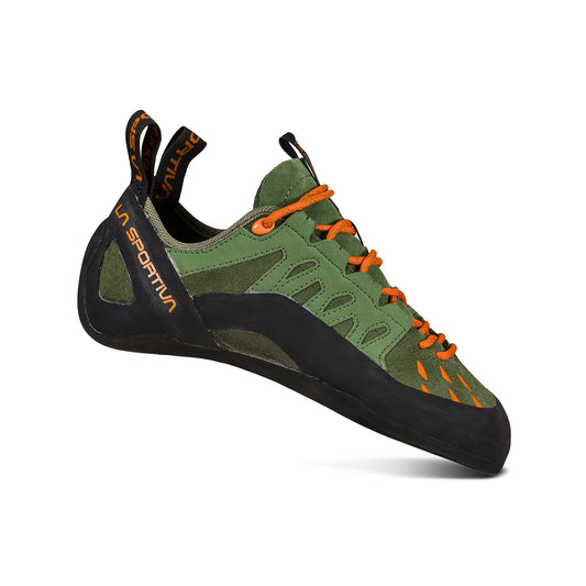 The La Sportiva Tarantulace is a green and black climbing shoe with orange laces and accents, displaying the La Sportiva logo on the heel and tongue. Its ergonomic design and FriXion RS sole deliver excellent grip for rock climbing.