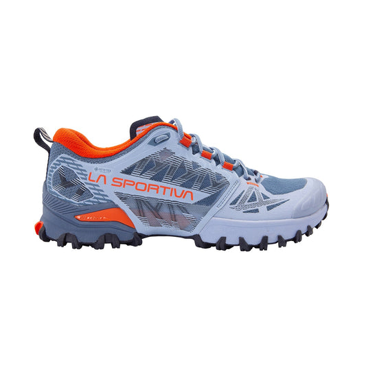 The La Sportiva Bushido III Wide GTX Women's is a blue and gray trail runner with orange accents, a black rugged sole, and waterproof Gore-Tex protection—perfect for any adventure.