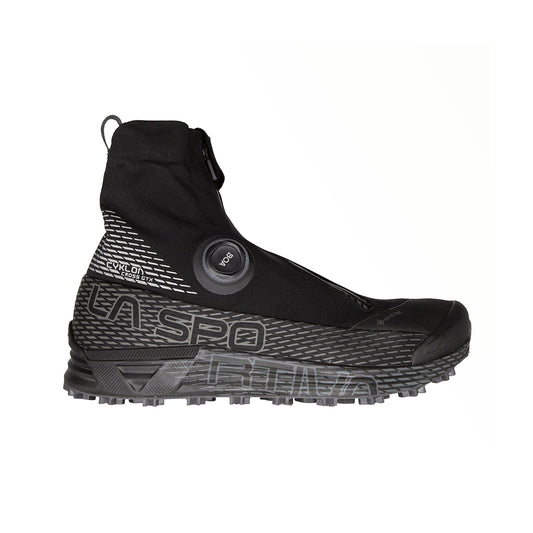 The La Sportiva Cyklon Cross GTX is a black winter running shoe with a high ankle collar, zipper closure, BOA Fit System dial, Gore-Tex waterproof protection, textured sole, and grey accents.