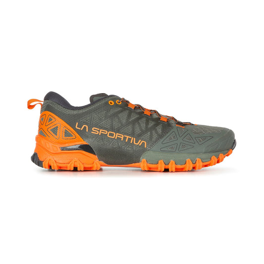 The La Sportiva Bushido II is a trail running shoe built for technical terrain, featuring a grey upper, bright orange sole and detailing, "La Sportiva" in orange on the side, and a rugged outsole for superior traction.
