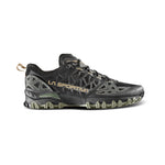 The La Sportiva Bushido II is a black and olive green trail running shoe with geometric side patterns, a rugged sole for technical terrain, and yellow La Sportiva branding on the side.