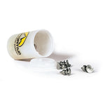 A small plastic container from La Sportiva lies on its side with its lid off, next to several Hobnails-Replacements metal studs for improved shoe traction—perfect for icy surfaces.