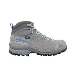 The La Sportiva TX Hike Mid Leather GTX Women's shoe is gray with light blue accents, black tread, metal eyelets, and features a reinforced toe and heel for durability. “La Sportiva” branding appears on the side.