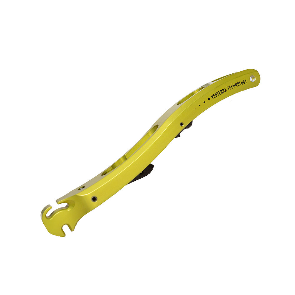 A yellow, curved metal tool with multiple openings, holes, and a hook end—marked "VETERAN TECHNOLOGY"—ideal for adjusting the Ski/Walk Mech Spitfire 2.0 by La Sportiva.