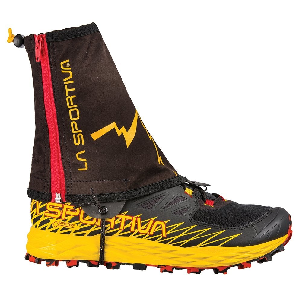 The La Sportiva Winter Running Gaiter is a black and yellow trail running shoe with a rugged sole, featuring a black Polartec Power Stretch gaiter, red zipper, and yellow La Sportiva branding covering the ankle and top.