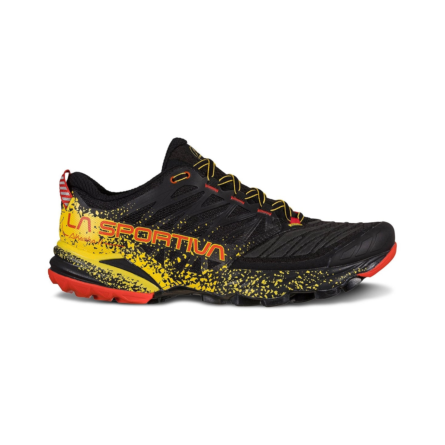 The La Sportiva Akasha II is a black trail running shoe featuring a yellow and orange splatter design, yellow laces, red accents, and the bold yellow La Sportiva logo. Its rugged sole is designed for high mileage on technical terrain.