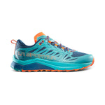 The La Sportiva Jackal II GTX Women's is a blue and teal trail-running shoe with orange accents, featuring the La Sportiva logo on the side and a cushioned, rugged sole for outdoor adventures.