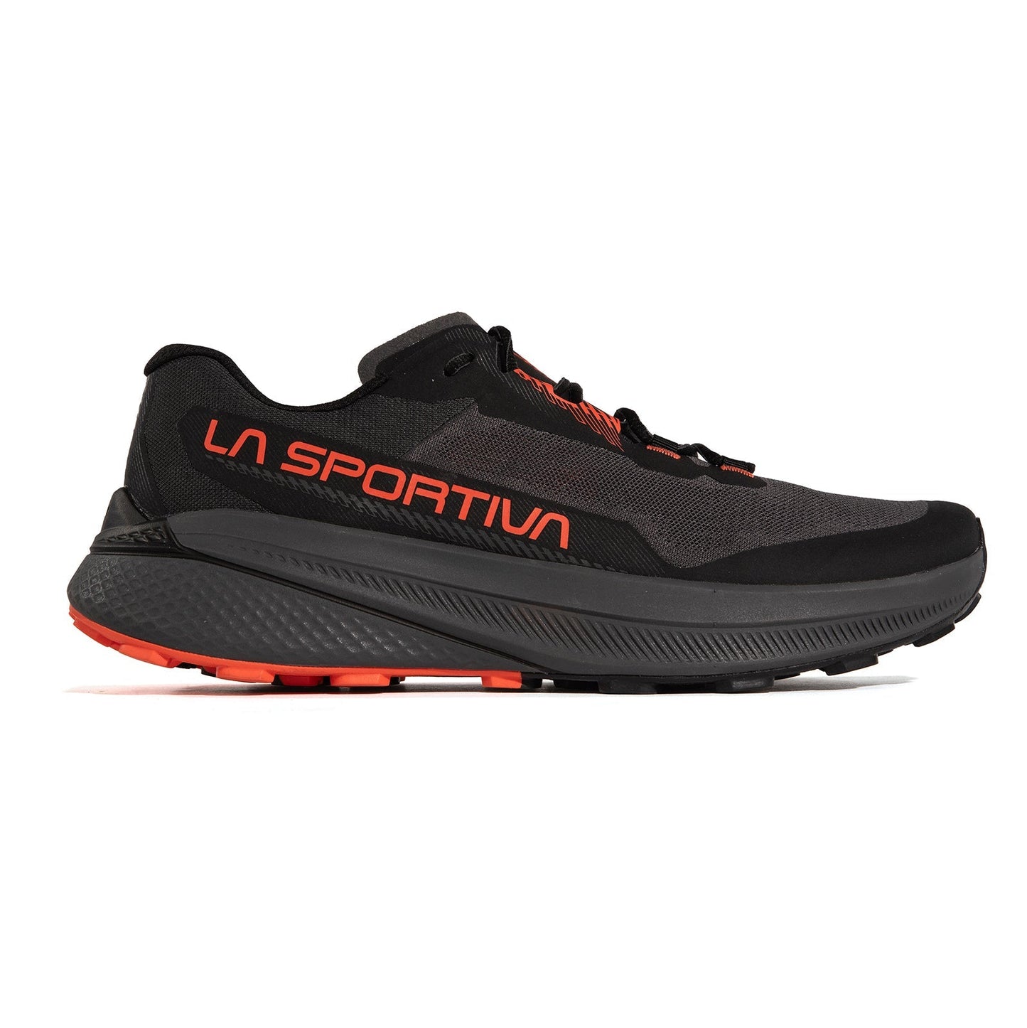 The La Sportiva Prodigio is a black and dark gray trail running shoe featuring orange branding, a thick textured sole with XFlow foam, and orange tread accents—offering a modern design ready for your next adventure.
