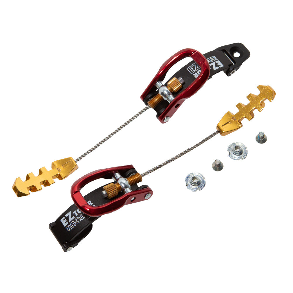 Two red and black La Sportiva Shell Buckle RPS3 2.1 (Spitfire 2.1) ski boot replacement buckles are linked by steel cables, with gold adjusters and three small silver nuts shown together on a white background.
