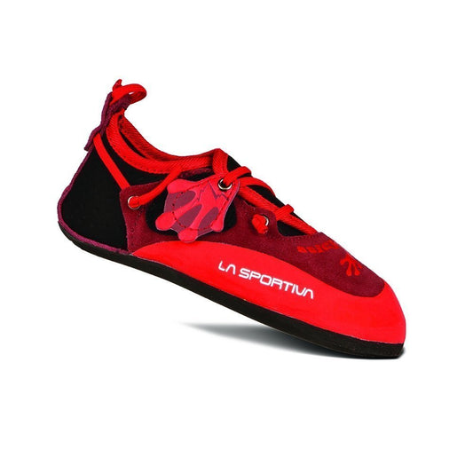 The La Sportiva Stickit kids' climbing shoe in red and black features an adjustable lacing system, a low-cut design, and a durable rubber sole—ideal for growing feet. Displayed at an angle on a white background.