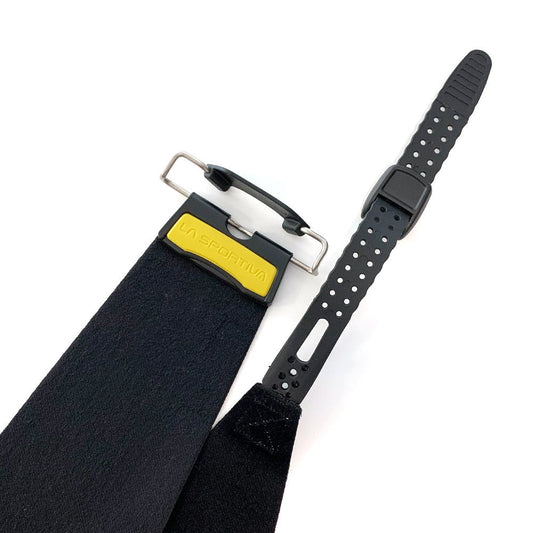 A close-up of the La Sportiva Skins - Capo LS Tour 189 ski climbing skin, featuring a yellow and black attachment clip, an adjustable perforated rubber strap, and durable mohair nylon for reliable grip.