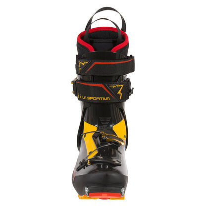 A single La Sportiva Skorpius CR touring boot in black, yellow, and red is shown from the front, featuring a high ankle, sturdy buckles, Velcro straps, and a pull loop—ideal for backcountry skiing.