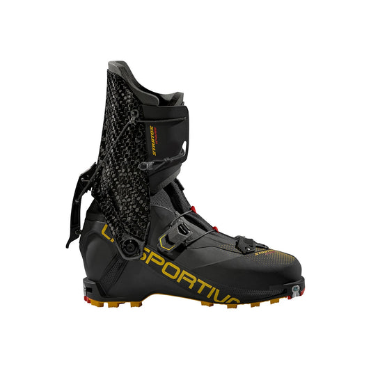 The La Sportiva Stratos Hybrid is a black mountaineering boot with yellow branding, a tall carbon cuff, carbon fiber accents, and layered fastenings for lightweight ski mountaineering, shown on a white background.