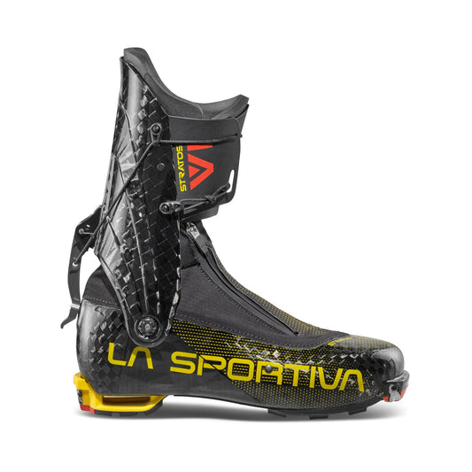 The Stratos VI by La Sportiva is a black ski boot with yellow and red accents, featuring a carbon fiber texture—perfect for ski mountaineering or as lightweight touring boots.