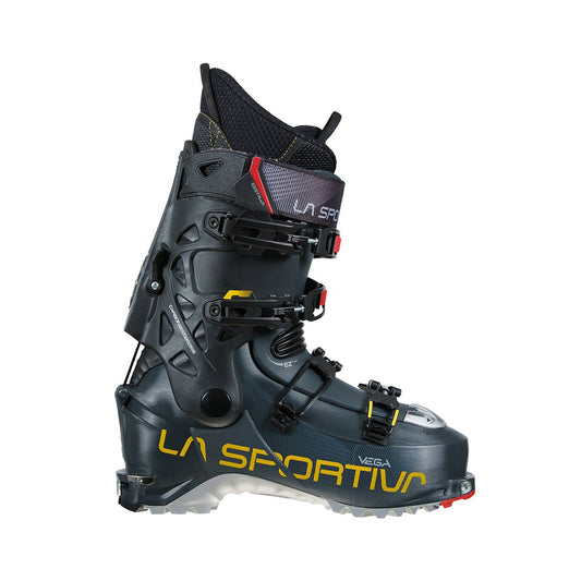 The La Sportiva Vega ski boot in black with yellow branding features multiple buckles and a rugged sole, designed for backcountry or alpine skiing, shown in side profile on a white background.
