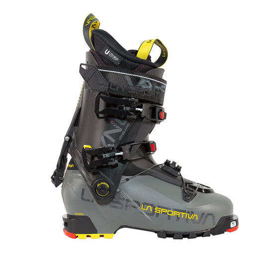 The La Sportiva Vanguard is a gray and black ski boot with yellow accents, multiple buckles, a power strap, and a rugged sole—perfect for ski touring or adventure skiing in the backcountry.