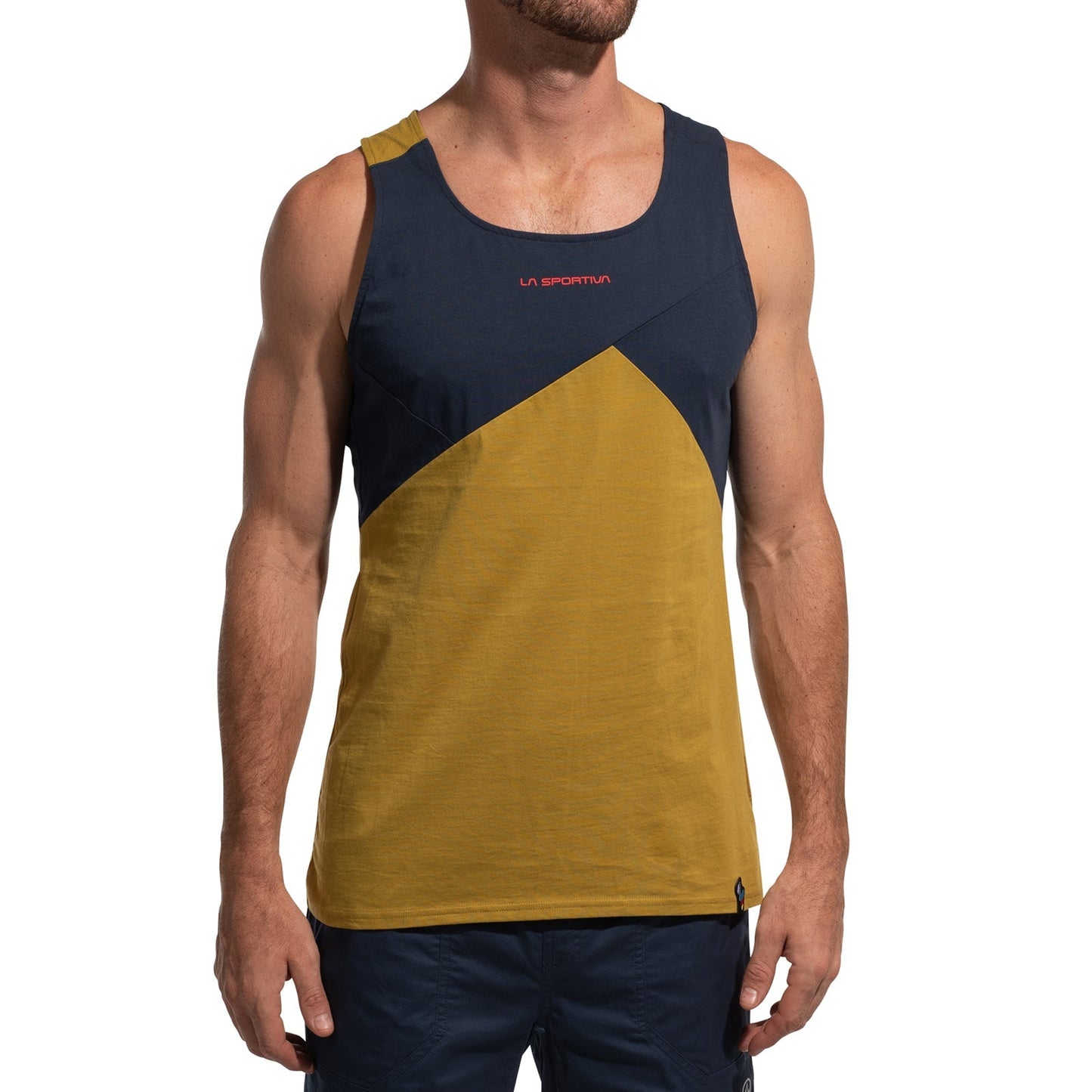 A man wears the La Sportiva Dude Tank Men's (2025), a sleeveless climbing top with navy and mustard color blocking plus a red logo on the chest, paired with dark blue shorts. His face is not visible.