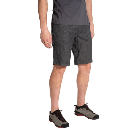 A person wearing lightweight La Sportiva Sierra Rock Shorts Men's (2025) in gray, a dark gray t-shirt, and gray hiking shoes with red accents stands against a white background. The outfit is designed for comfort. The person's head is not visible.