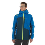 A man in La Sportiva's Crizzle EVO Shell Jacket—a blue hardshell with a hood, yellow zipper, and black accents—faces left against a white background, highlighting the jacket’s water resistance and wind protection.