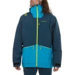 A person wears the La Sportiva Chaser EVO Shell Jacket Men's—a blue and teal ski touring shell with a high collar, hood, underarm vents, and neon yellow zippers—standing against a plain white background.