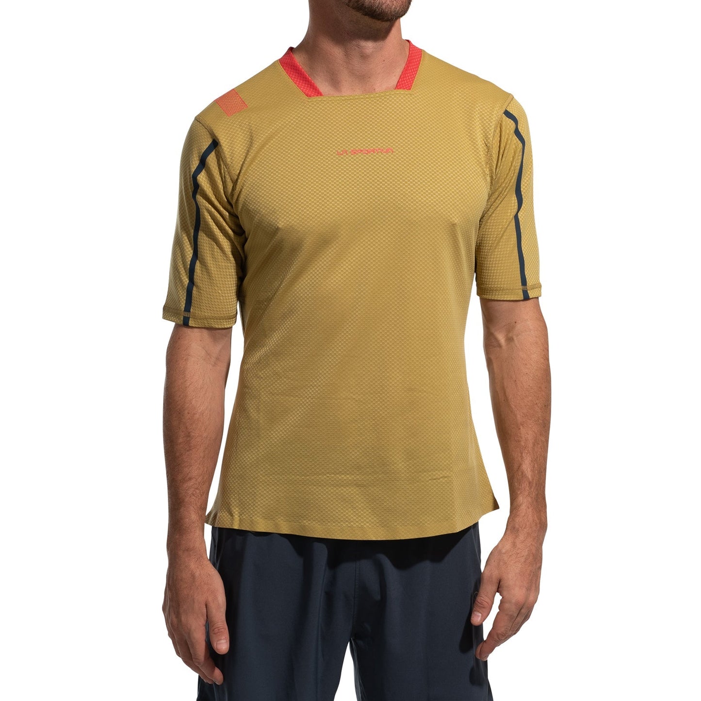 A man stands against a plain white background wearing the La Sportiva Trail Bite T-Shirt Men's in yellow with red accents, featuring a textured, moisture-wicking fabric and fitted style, paired with dark blue shorts—perfect for trail running.