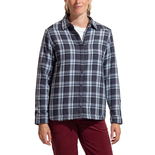 A woman wearing the La Sportiva Rambler Lined Flannel Shirt in blue/gray plaid over a white T-shirt and maroon pants stands against a plain white background.