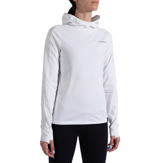 A person wears the La Sportiva Cloud Shadow Sun Hoody Women's—lightweight, long-sleeve, white with UPF 50 and a small logo on the upper left chest—and black pants against a plain white background. The face is partially out of frame.