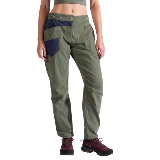 A person wearing La Sportiva Labyrinth Pants Women's in olive green with an adjustable waistband and navy pockets, a cropped green top, and black and red hiking shoes, stands against a white background.