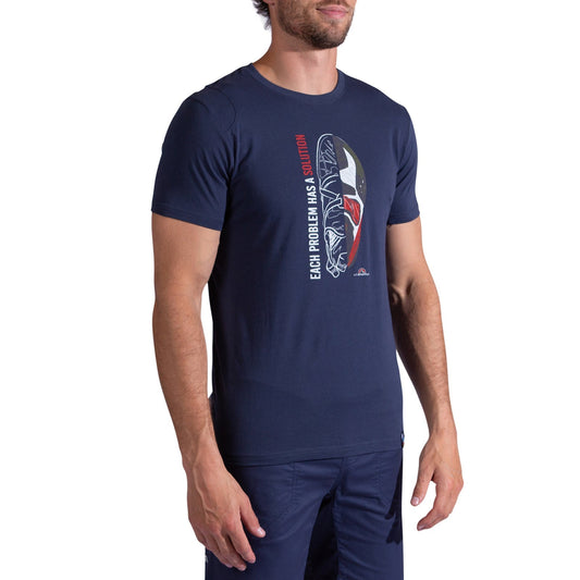 A man stands against a white background wearing the La Sportiva Solution T-Shirt Men's, an organic cotton tee featuring a climbing shoe graphic and the vertical text "EACH PROBLEM HAS A SOLUTION"—ideal for climbers.