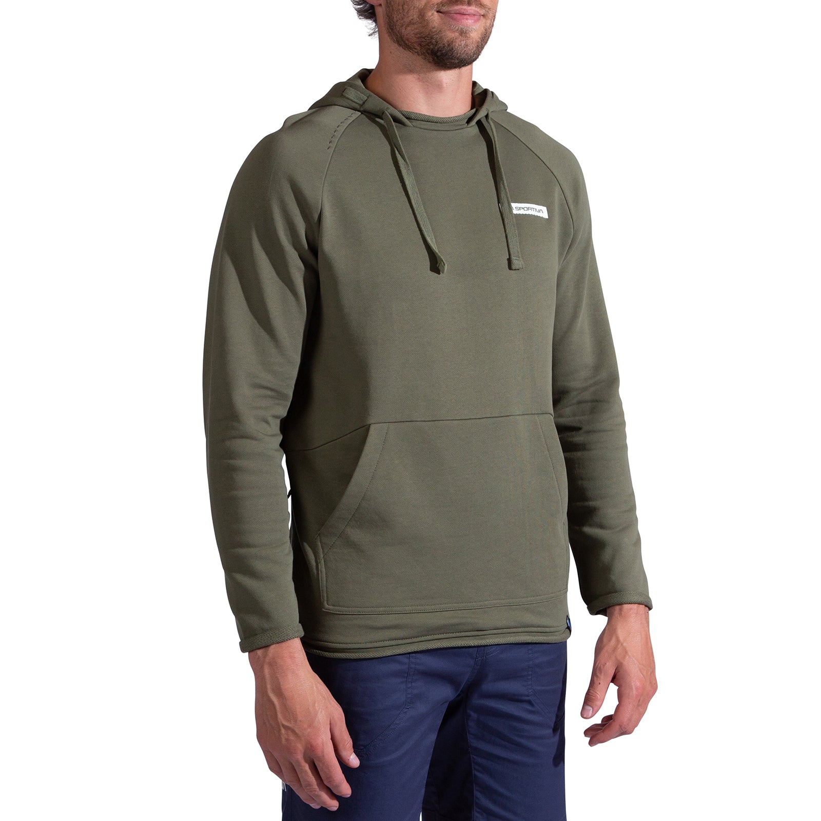 A man wearing a La Sportiva Telendos Hoody Men's in olive green organic cotton with a front pocket and dark blue pants stands against a plain white background.