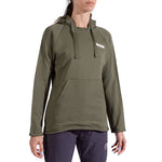 A woman wears the La Sportiva Telendos Hoody Women's in olive green—an organic cotton hoody with a front pocket and drawstrings—paired with dark pants, standing against a plain white background.