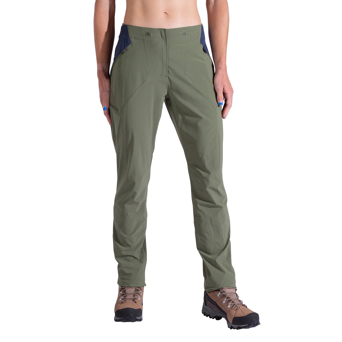 A person wearing La Sportiva Monument Pants Women's in olive green with brown hiking boots and a dark blue waistband is shown from the waist down against a white background, highlighting this stylish and breathable hiking apparel.