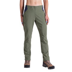 A person wearing La Sportiva Monument Pants Women's in olive green with brown hiking boots and a dark blue waistband is shown from the waist down against a white background, highlighting this stylish and breathable hiking apparel.