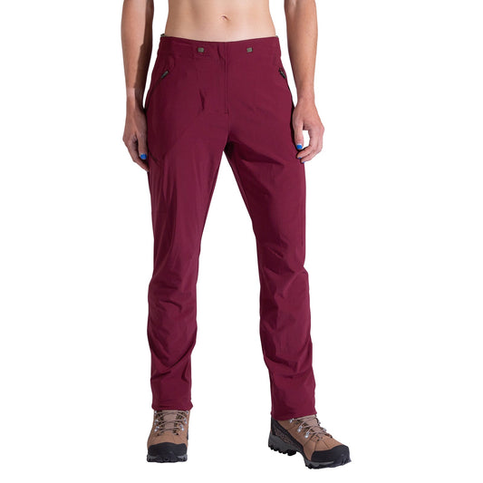 A person wears La Sportiva Monument Pants Women's in maroon with brown hiking boots, standing with arms relaxed at their sides, shown from shoulders down against a plain white background.