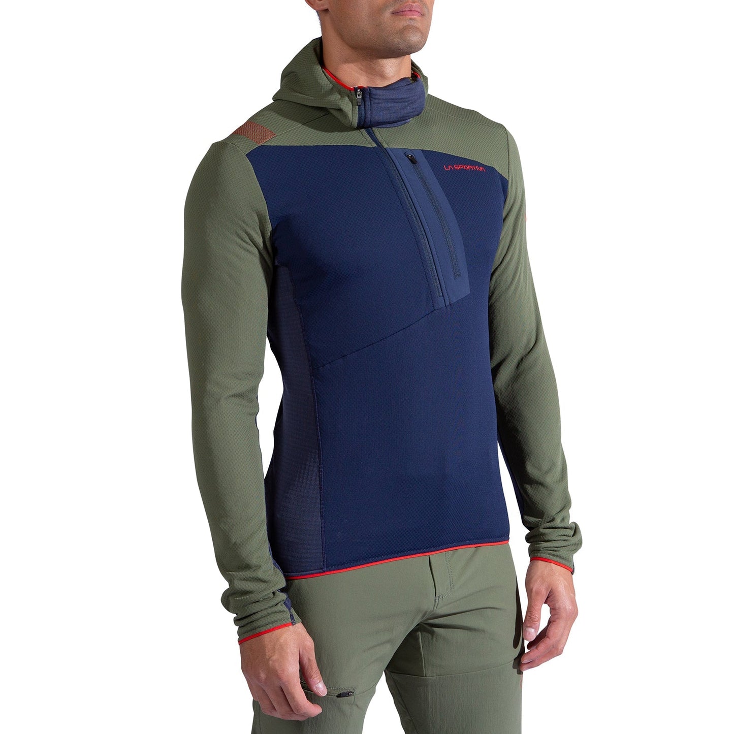 A man wears the La Sportiva Big Wall Pullover Hoody Men's, featuring a fitted design with olive green sleeves and sides, a navy blue front panel, hood, chest zipper, and subtle red accents.