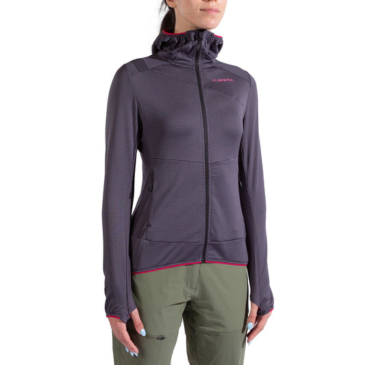 A person is wearing a La Sportiva Aequilibrium Thermal Hoody Women's in dark gray with pink accents and a hood, paired with olive green pants. The background is plain white.
