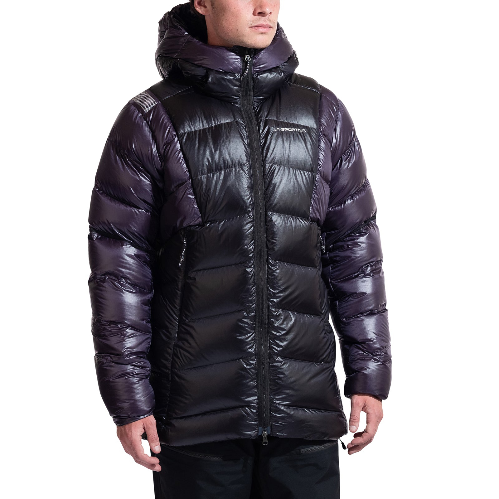 A person wearing a shiny black La Sportiva Supercouloir Down Parka Men's with a hood stands with arms relaxed. The packable jacket features horizontal quilting, a front zipper, and the person's face is partially visible.