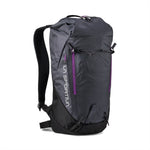 The La Sportiva Granite 22 Backpack is black and dark gray with purple zipper accents, padded shoulder straps, a top loop handle, external zippered pockets, and adjustable bottom straps.