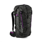The La Sportiva Challenger 28 Backpack is black with purple accents, front bungee cords, adjustable shoulder straps, a padded hip belt, and "La Sportiva" printed vertically on the front left side.